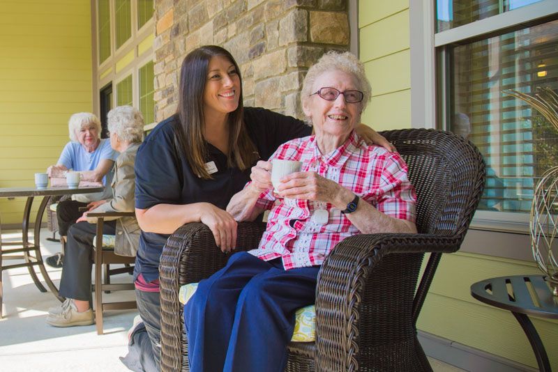 Pavilion caregiver providing respite care to seniors