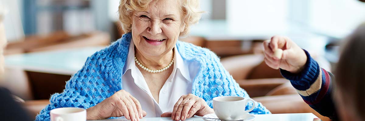Senior living respite care resident chats with caregiver